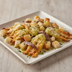Fiori di zucca al forno con alici e Grana Padano