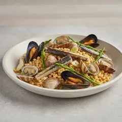 Fregola con frutti di mare e salicornia