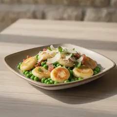 Gnocchi di ricotta con piselli, pecorino e guanciale