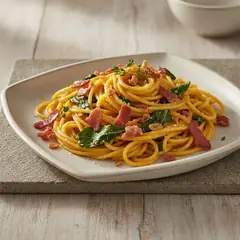 Pasta con crema di zucca, speck e cavolo nero
