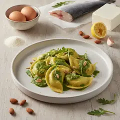 Ravioli ripieni di branzino con salsa di rucola