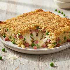Riso al forno filante con piselli e speck