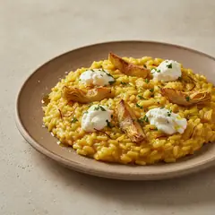 Risotto allo zafferano con carciofi e caprino