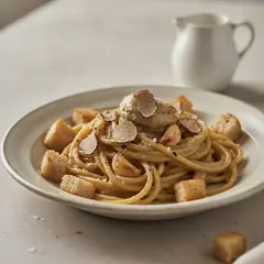 Spaghetti con crema di aglio e tartufo