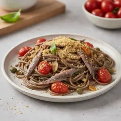 Spaghetti di grano saraceno con alici e pomodorini