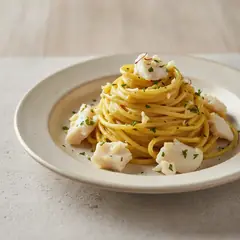 Spaghettoni con baccalà, crema di patate e zafferano